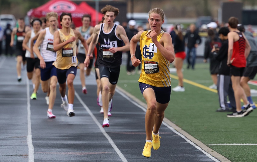 Grand Haven’s Luca Hammond, followed by Ann Arbor Pioneer’s Beckett Crooks, pushes toward the finish during the Diamond 1,600 at Romeo’s Barnyard Invitational this season.