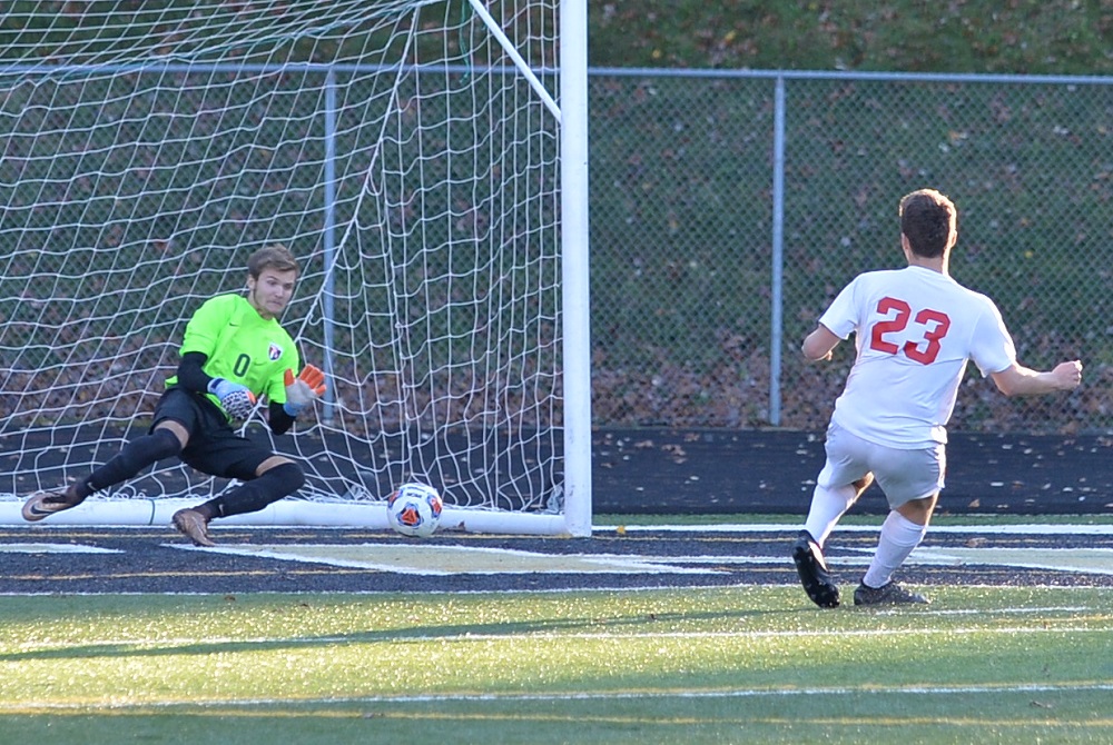 A player sends a shot on goal during the 2016 Division 1 Boys Soccer Final. 