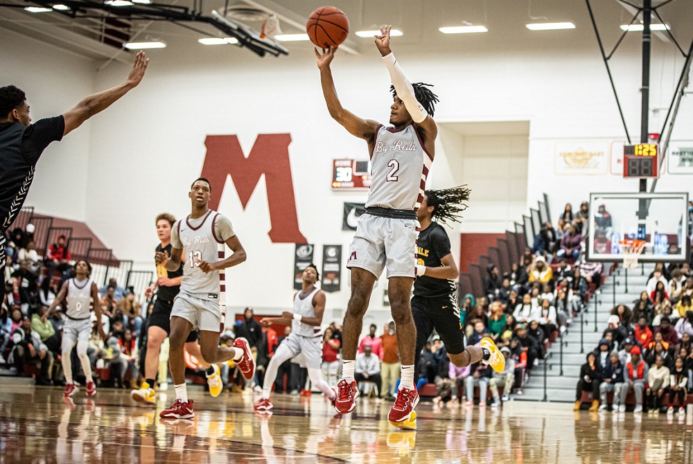 Muskegon’s Jordan Briggs (2) pulls up for a shot at the 3-point arc during his team’s win Saturday over Ferndale.