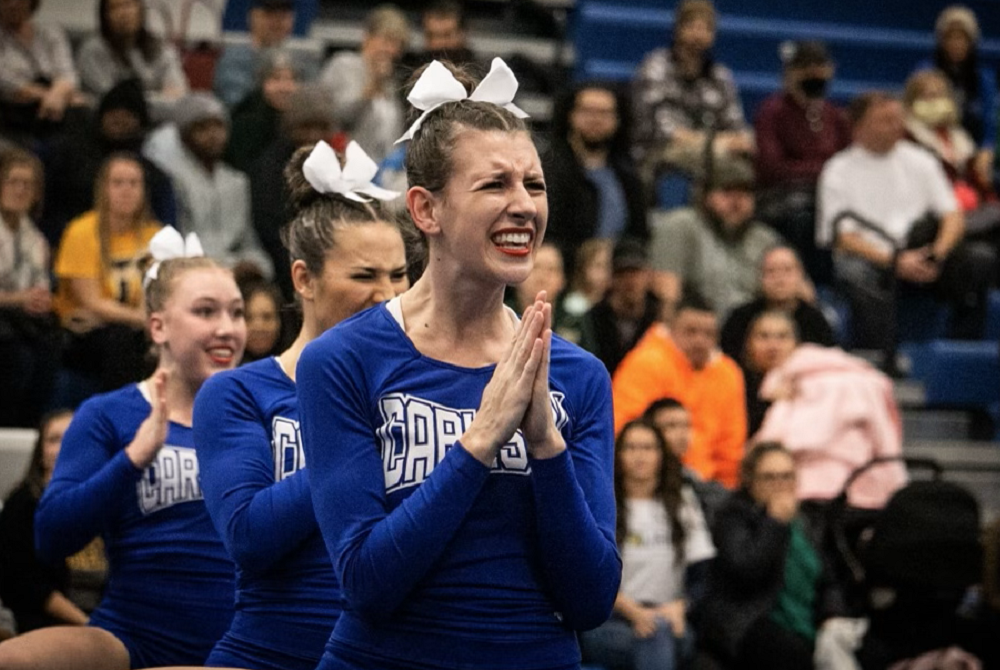 Gibraltar Carlson's Kaitlynn Demers cheers during competition. 