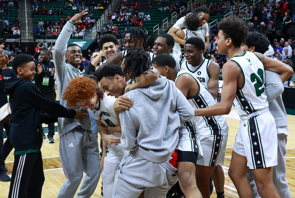 Detroit Cass Tech players celebrate their Division 1 championship win Saturday along with a last-second 3-pointer by teammate Mathieu Collins (30).