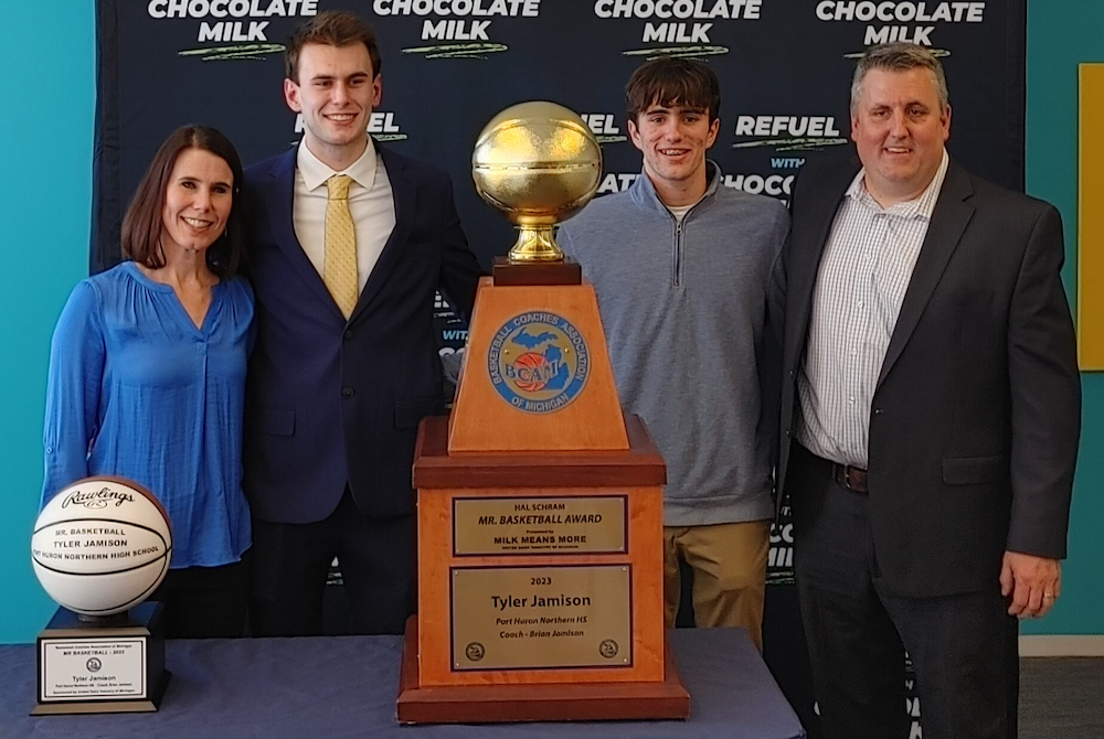 Tyler Jamison, second from left, with his parents and brother, stands with his newly-received Mr. Basketball Award trophy during the ceremony at the Detroit Free Press. 
