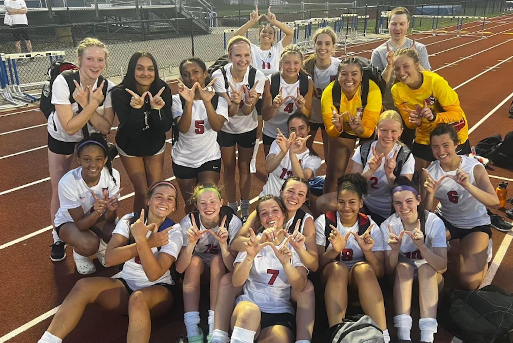 The East Kentwood girls soccer team celebrates a win this spring. 