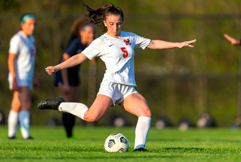 Northville's Helena McLellan steps into a kick during a May 9 draw with Hartland.