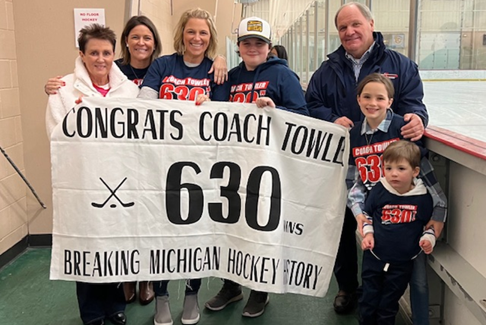 Genesee Generals hockey coach Doug Towler, far right, celebrates his record 630th win with family Dec. 23. 