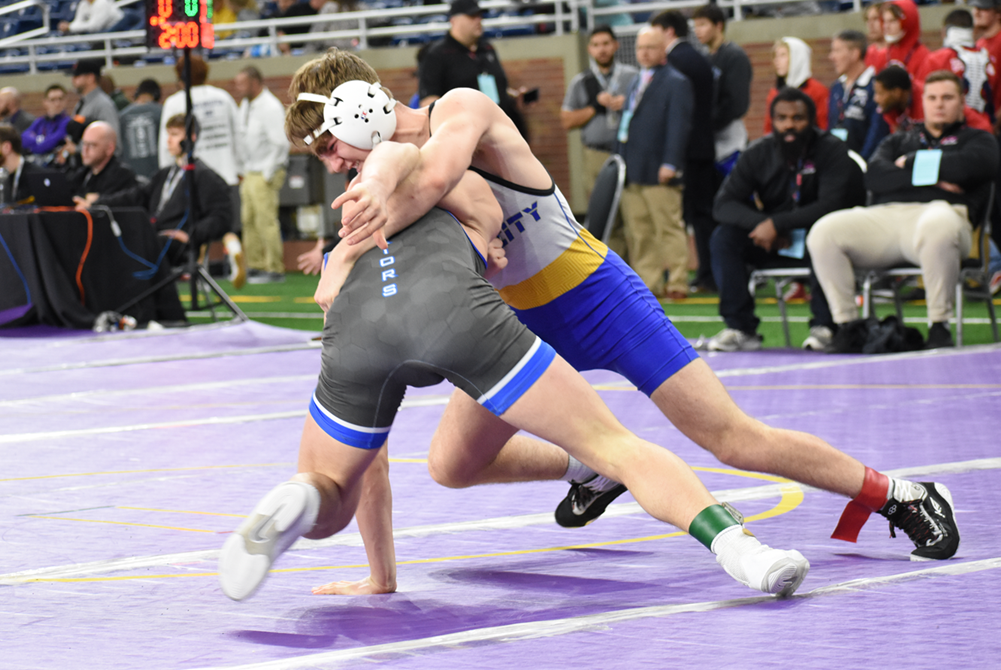 Imlay City’s Dominic D’Ambrosio, right, wrestles to a fifth-place finish at 132 pounds in Division 3 last season at Ford Field.