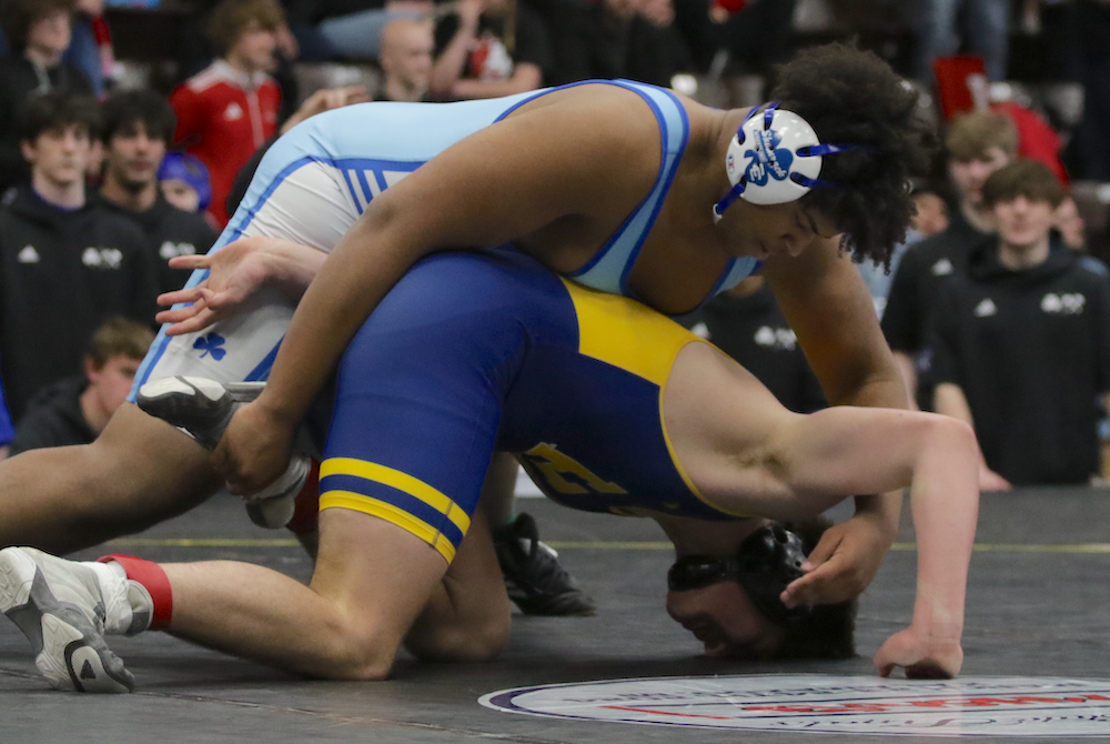 DCC’s Benny Eziuka, top, locks up with Hartland’s Jacob Pretzel at 285 pounds in Saturday’s Division 1 Final. 