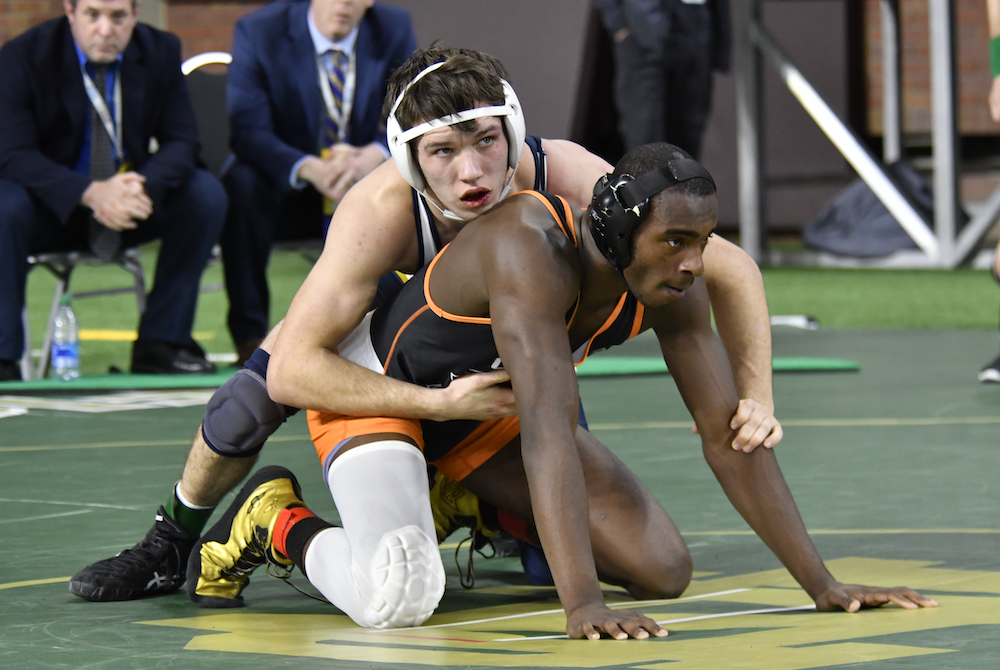 Gaylord’s Zane Willobee, left, and Clio’s D’Marion Erlenbeck ready for the restart of their match at 157 pounds Saturday.