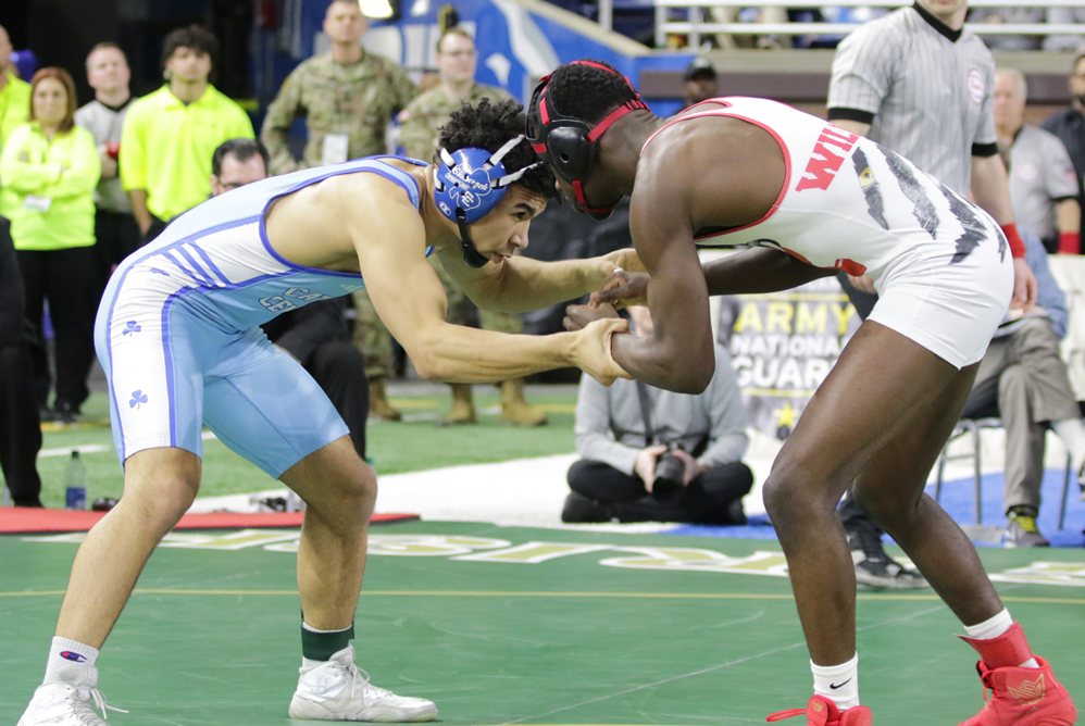 DCC's Darius Marines wrestles Roseville's Jay'Den Williams in the Division 1 157-pound championship match Saturday at Ford Field.