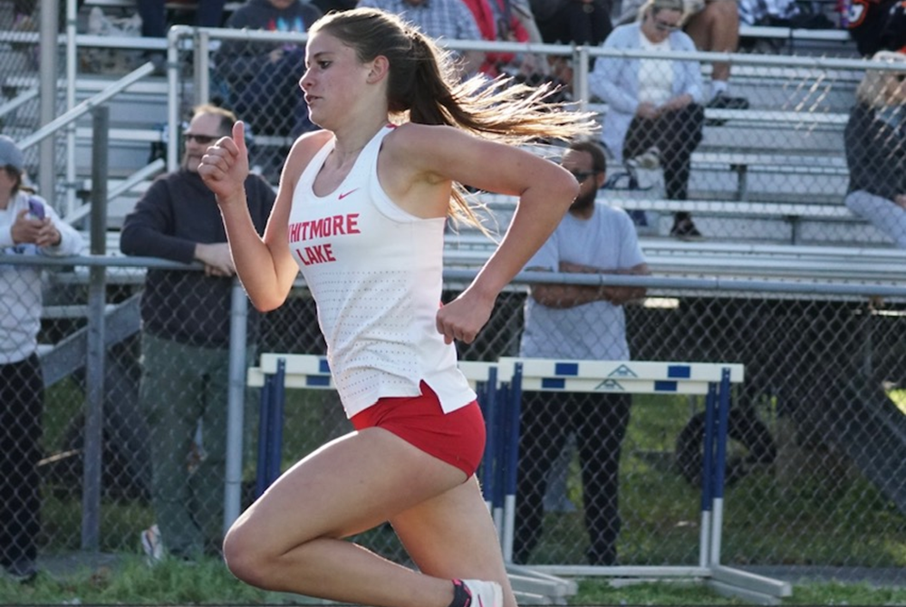 Kaylie Livingston runs one of her races this season as a freshman for Whitmore Lake.