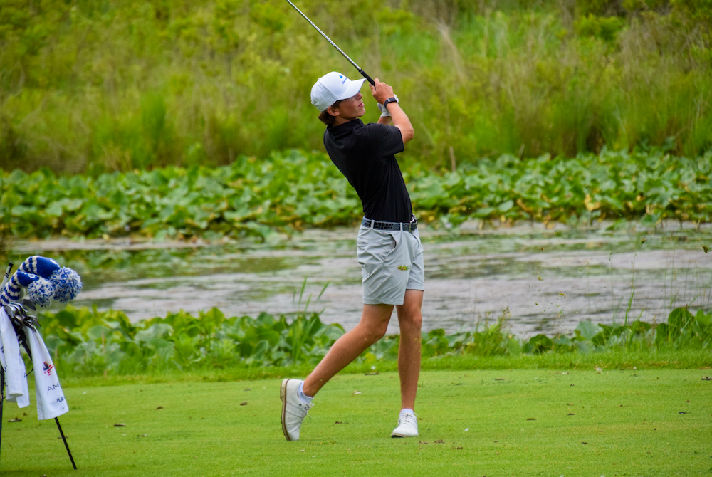 Detroit Catholic Central’s Julian Menser follows an approach shot during Saturday’s second round. 
