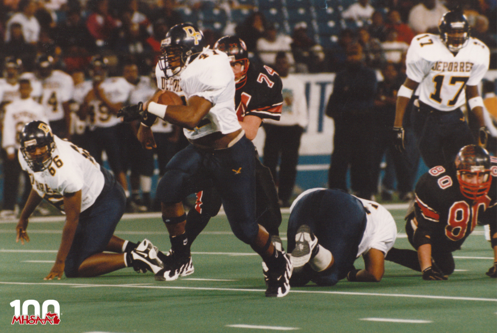 Byron Glaspie of the Detroit St. Martin dePorres breaks free for a big gain. The Eagles would win 14-6 over Whittemore-Prescott. (1996 Class CC Football Finals)