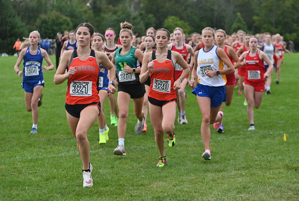 Newberry's Samantha Taylor (321) and Abby Taylor (320) lead the beginning of the Wildcat Invite last month at Northern Michigan University, with Samantha eventually finishing first and Abby third. 