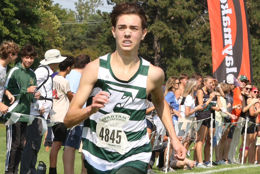 Freeland's TJ Hansen surges toward the finish of this season's Spartan Invitational Elite race.