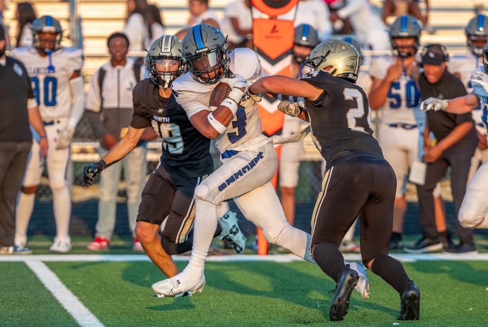 Harrison Township L'Anse Creuse's Donovan Rey (3) breaks through an opening during his team's 54-20 win over Macomb L'Anse Creuse North last week.