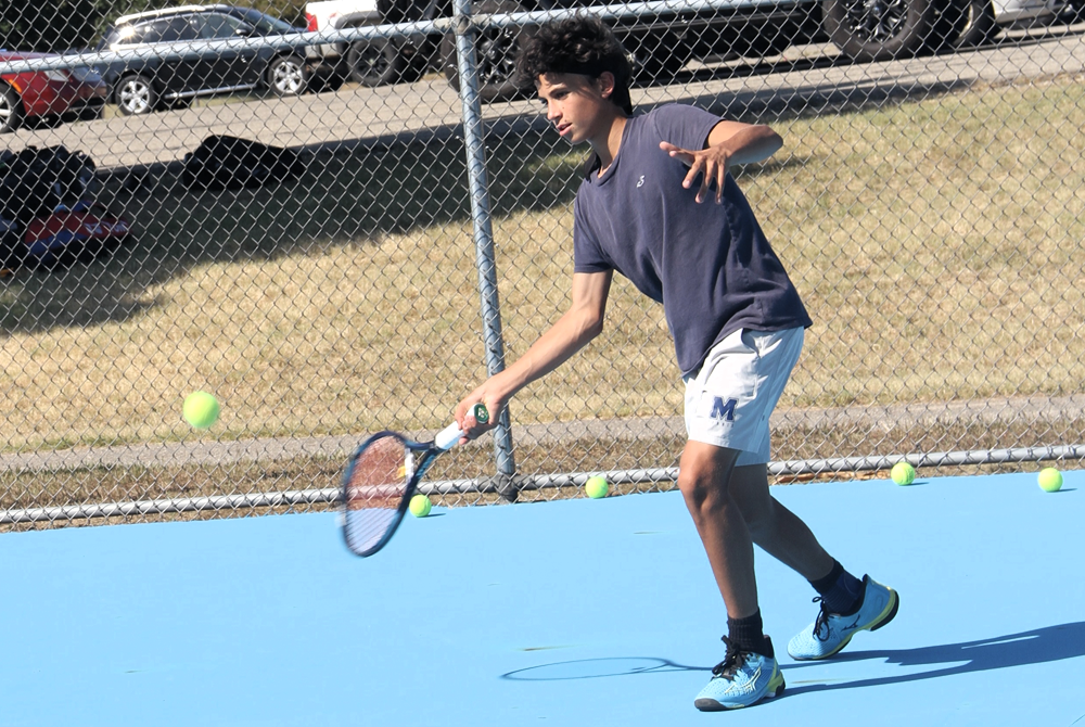 Mattawan’s Dylan Hodgman volleys during a recent practice.