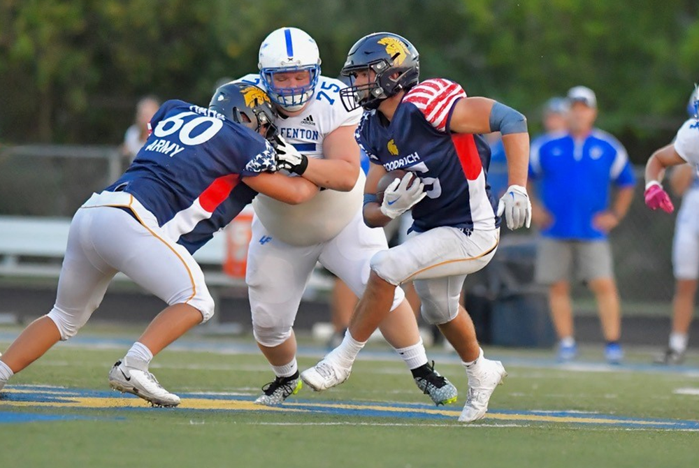 Goodrich's Chase Burnett follows teammate Gavin Sukup's block during a Week 3 win over Lake Fenton. 