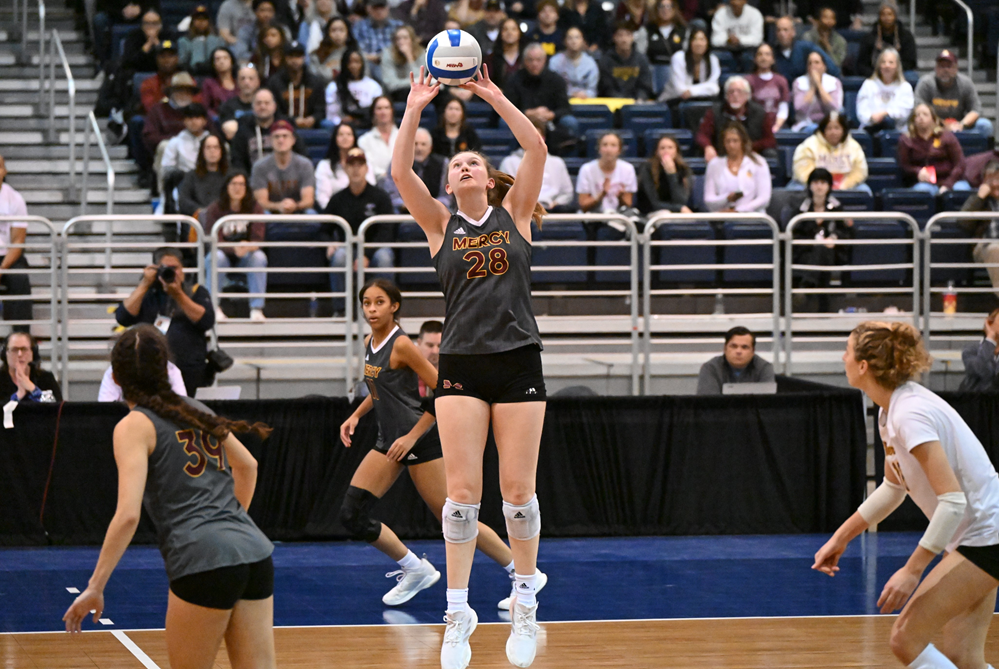 Campbell Flynn (28) sets Farmington Hills Mercy’s attack during last season’s Division 1 championship win over Grand Rapids Forest Hills Northern.