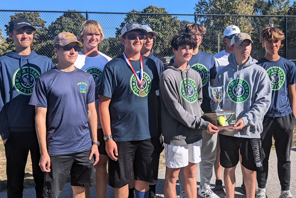 The Bay City John Glenn boys tennis team shows off its newly-won Bay County championship trophy this season.