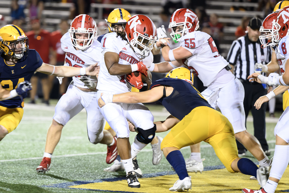 Grand Rapids Northview's Jalen Gant (1) works to break a tackle against East Grand Rapids during a Week 4 win. 