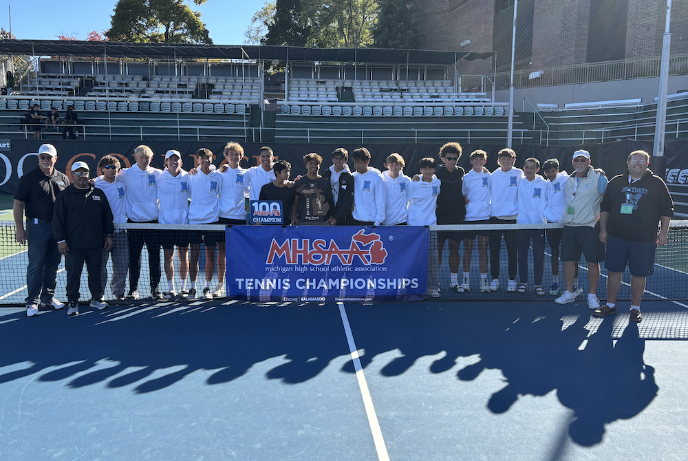 Grand Rapids Forest Hills Northern's boys tennis team takes a photo after winning the Division 2 title.