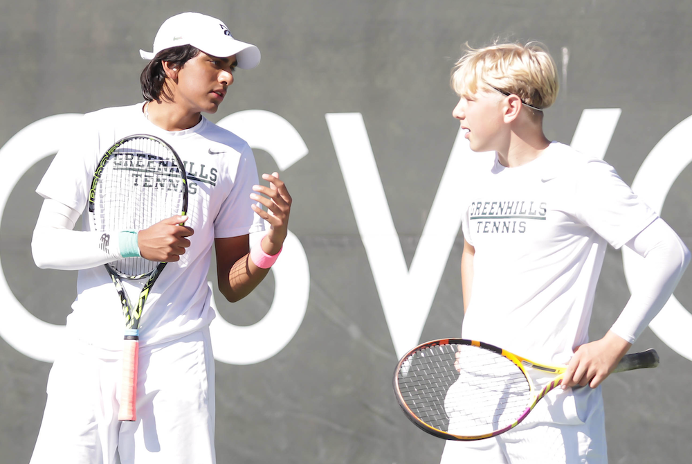 Ann Arbor Greenhills’ Kabir Rajendra, left, and William Pearce talk things over during their comeback to win the No. 1 doubles championship Saturday.