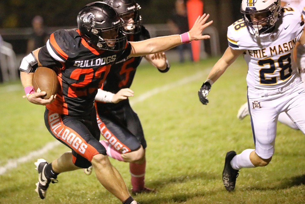 Petersburg Summerfield’s Mitchell Gomulinski (23) prepares to take on a defender from Erie Mason this season.