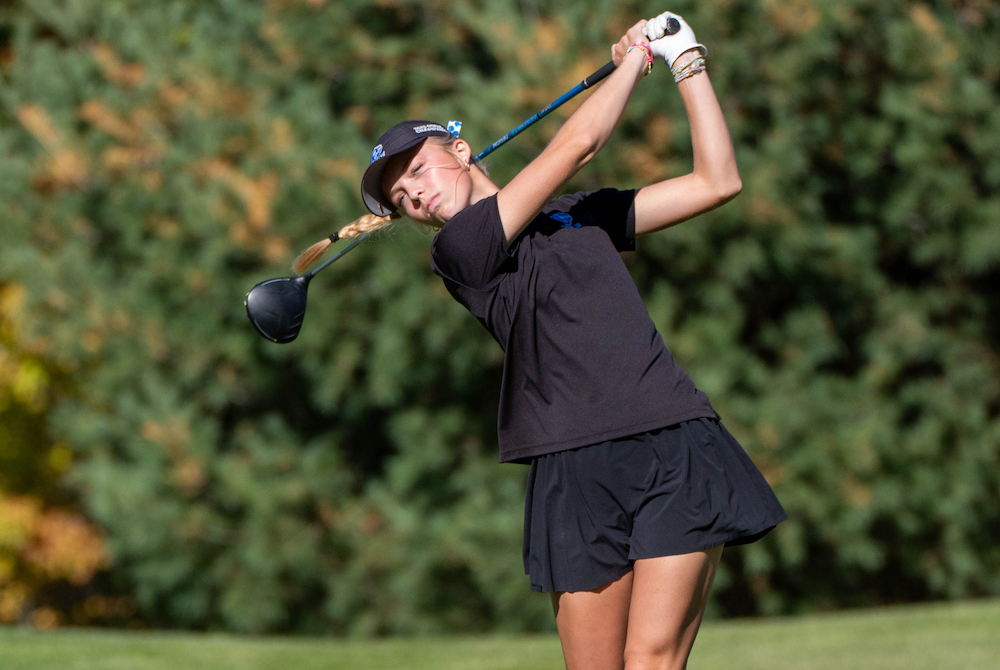 Grand Rapids Catholic Central’s Margaret Deimel follows a drive during Saturday’s second round at Bedford Valley.