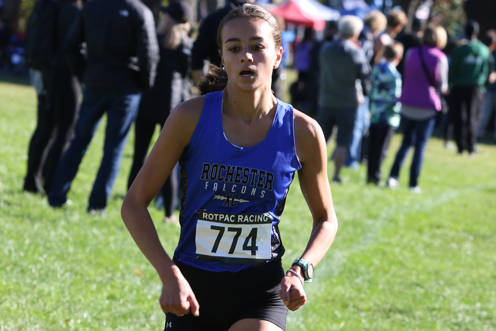 Rochester’s Lucy Cook runs to her fourth Oakland County championship this season.