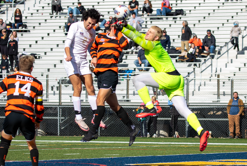 Notre Dame Prep’s Benjamin Liparoto (2) heads a shot past the last lines of Elk Rapids’ defense for the first goal of the Division 3 Final on Saturday.