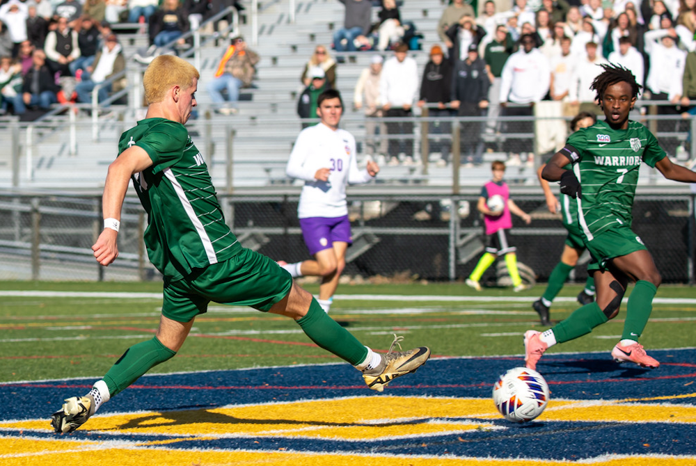 Mason Bonnema (22) puts a foot into the winning shot for Western Michigan Christian on Saturday at Grand Ledge.