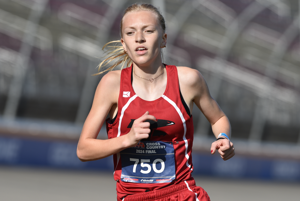 St. Johns’ Ava Schafer finishes an undefeated season during the final stretch of Saturday’s Division 2 race.