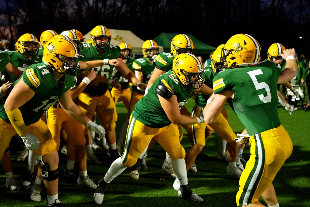 Howell players huddle in anticipation of taking the field before their Week 9 win over Belleville.