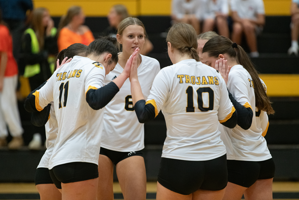 Traverse City Central players, including Elyse Heffner (6), Adelae Nelesen (10) and Bella Hernalsteen (11) huddle before the start of a match this season.