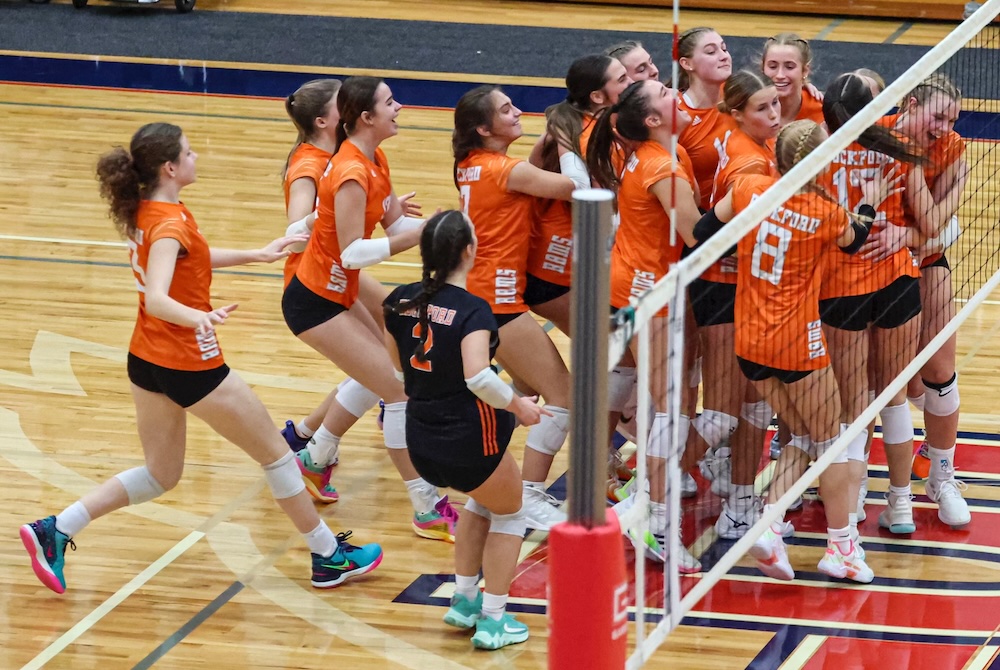 Rockford celebrates its Quarterfinal win over Traverse City Central on Tuesday at Big Rapids High School. 