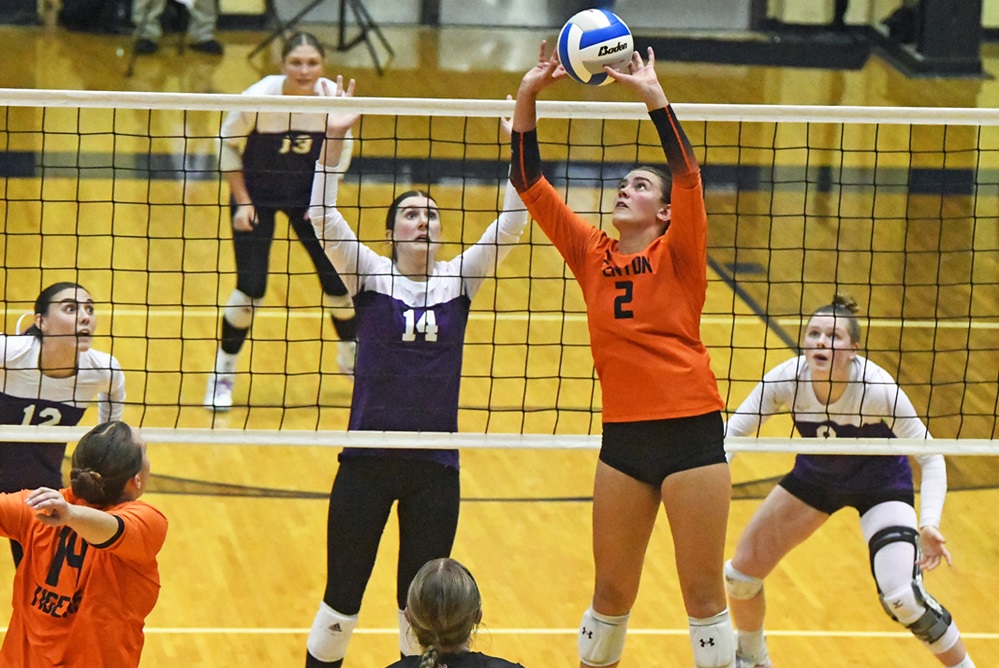 Fenton's Eva Long (2) sets during Tuesday's Division 1 Quarterfinal, as Battle Creek Lakeview's Karlee Gutsue (14) and her teammates anticipate the next hit. 