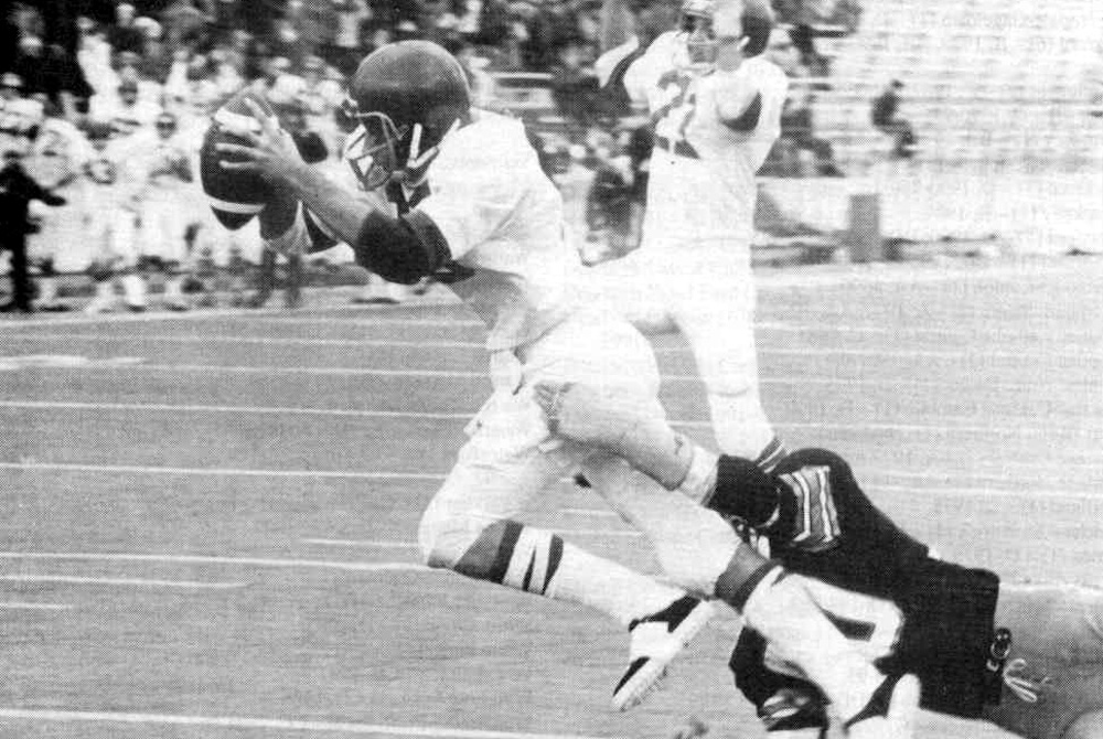 Ishpeming's Mark Marana works to break away from a tackler during the 1975 Class C Final.