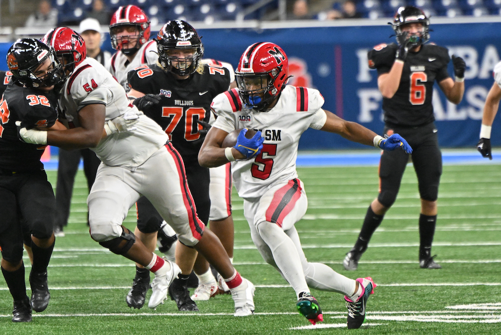 Orchard Lake St. Mary’s Darrin Jones (5) breaks into an opening during Saturday’s Division 2 Final at Ford Field.