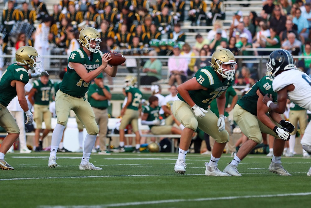 Notre Dame Prep quarterback Sam Stowe (15) takes a snap against Detroit Central during a 49-14 Week 1 win.