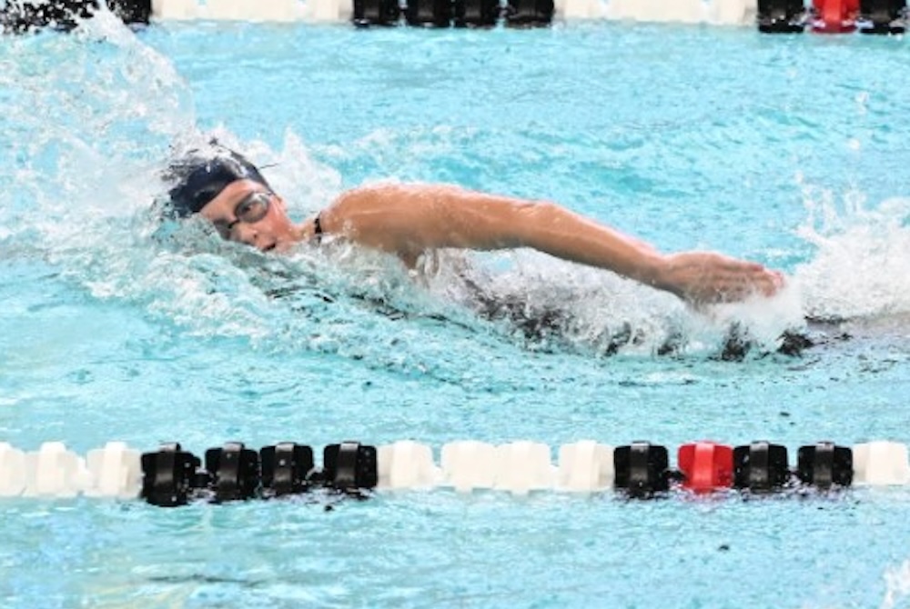 East Grand Rapids' Kate Simon swims a freestyle race. 