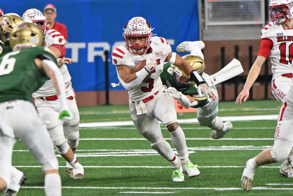 Millington’s Dallas Walsh (5) busts into a wide opening during Saturday’s Division 7 Final at Ford Field.