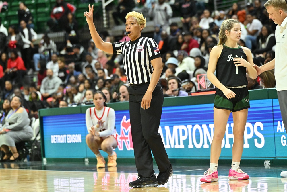 A basketball official signals two free throws during last season's Division 2 Final at Breslin Center.