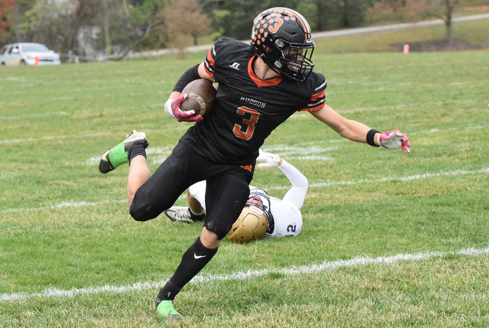 Hudson running back Grayson Bills looks upfield while carrying the ball against Schoolcraft in their Regional Final this season. 