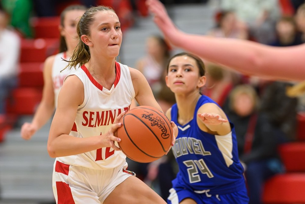 A Saginaw Michigan Lutheran Seminary player prepares to pass during her team's 56-37 win over Saginaw Nouvel Catholic Central on Friday. 