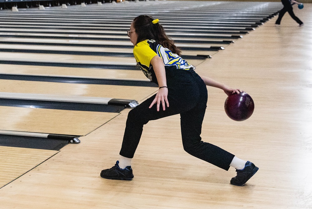 A bowler winds up to throw a ball during warmups for the 2022 Finals. 