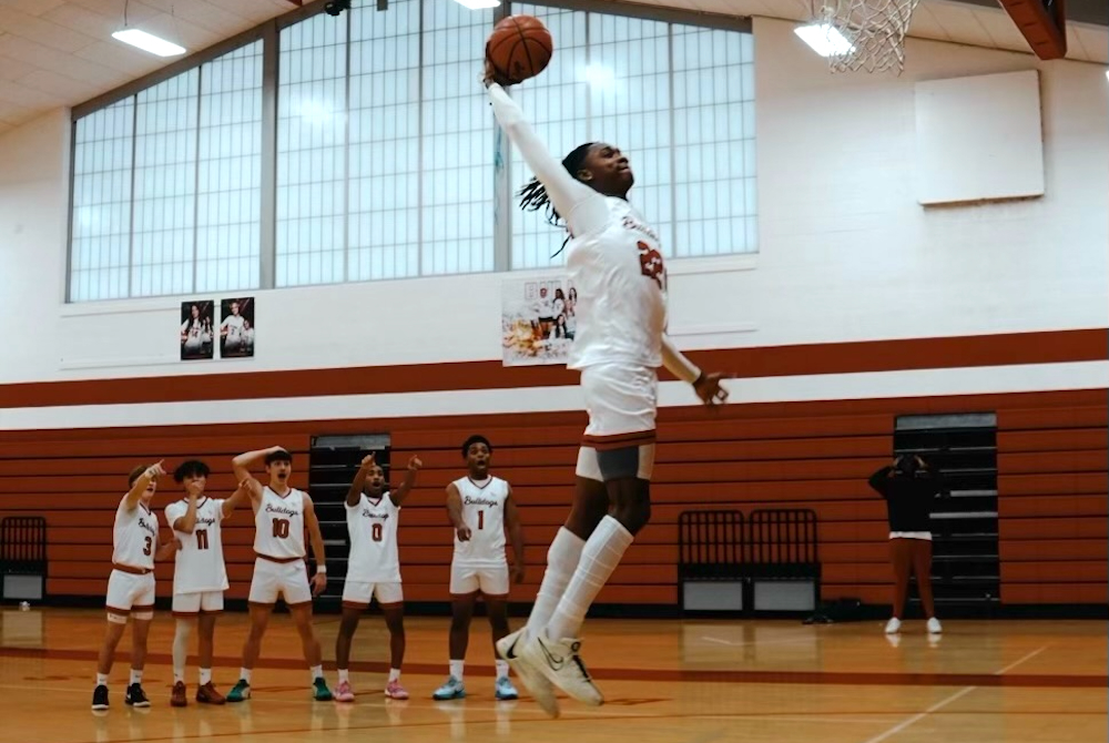 McRecco McFadden goes up for a dunk while his teammates watch at the Burton Bentley gym.