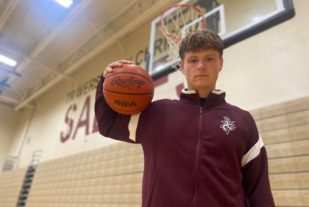 Traverse City Christian’s Reese Broderick, here holding a ball in front of a basket, is approaching the MHSAA record for career 3-pointers. 