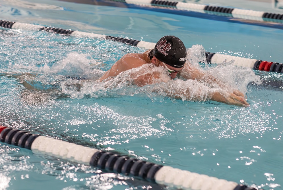 Holland Christian's Levi Rozema swims during a practice.