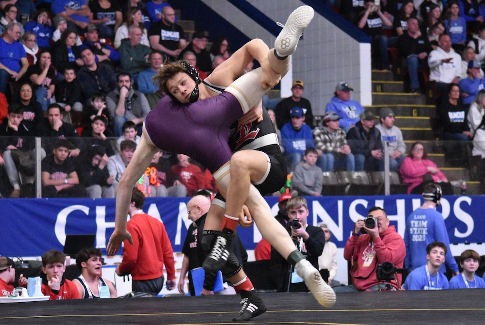 Lowell's Owen Segorski, right, locks up his opponent during Saturday's Division 2 Final.