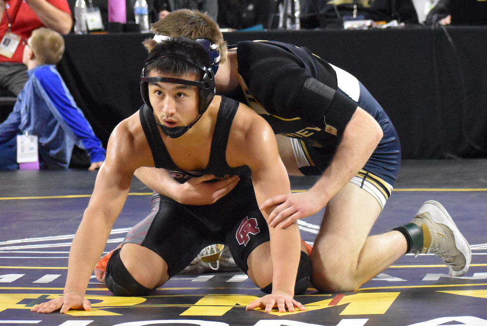 Riverview Gabriel Richard’s Sebastian Martinez, front, prepares for the referee to restart his match.